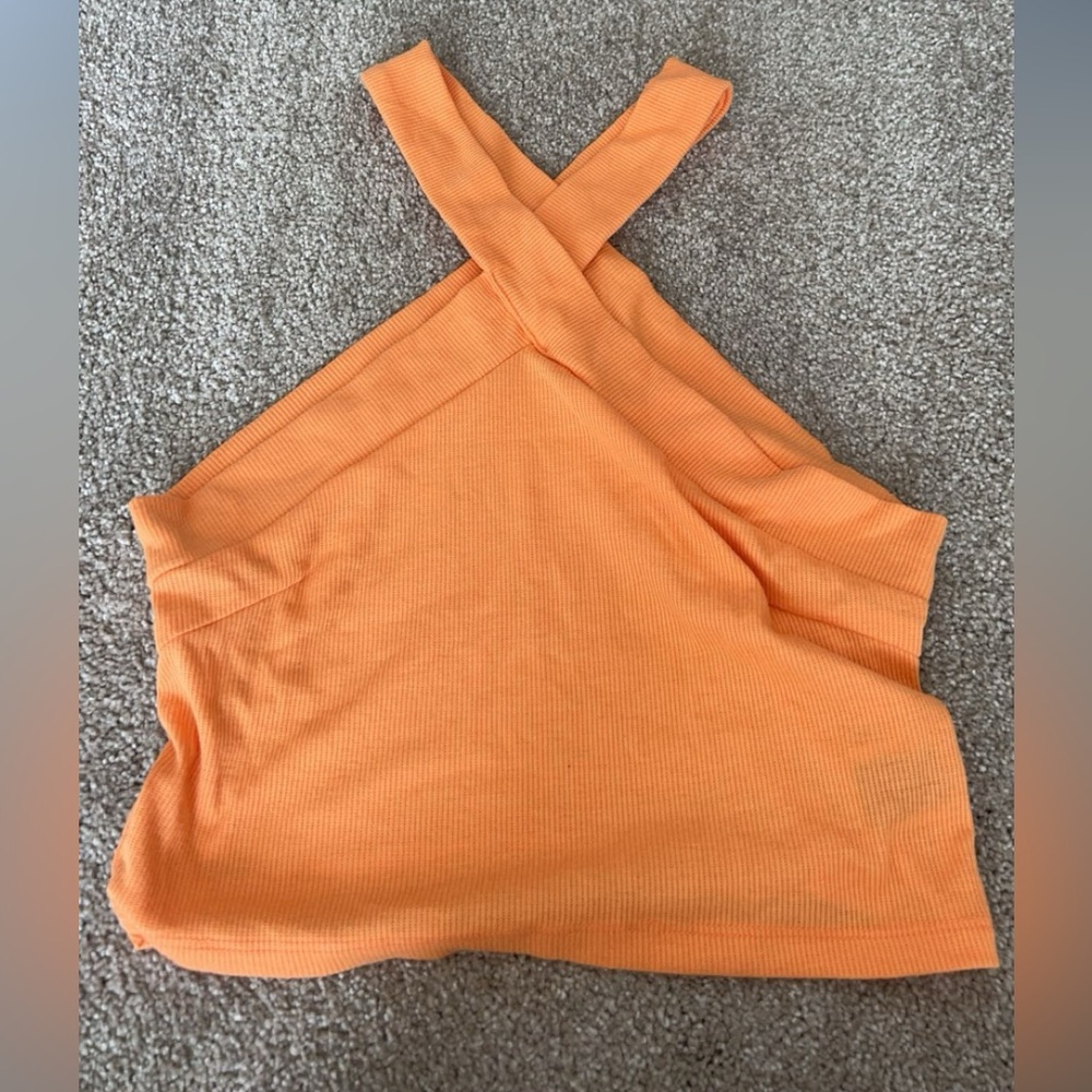 Front crossed orange cropped tank